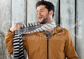 Man against wood with warm scarf