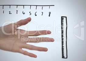 Rulers measuring size of long hand and fingers