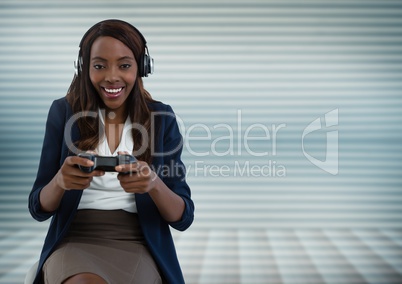 Businesswoman playing with computer game controller