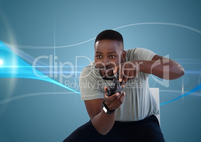 man playing with computer game controller with blue curved background