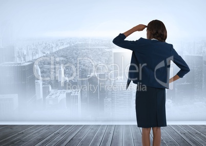 Businesswoman looking out over city