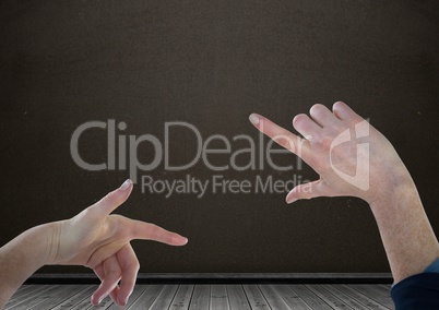 Hands interacting and pointing with blackboard background