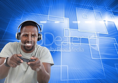 Businessman playing with computer game controller with blue motion background