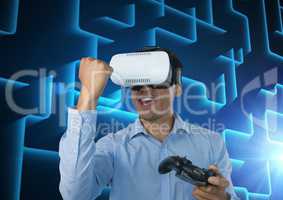 Businessman playing with computer game controller with blue maze background