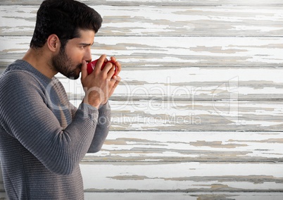 Man against wood with cup