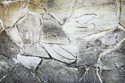 Fragment of an ancient wall from stones. Background image