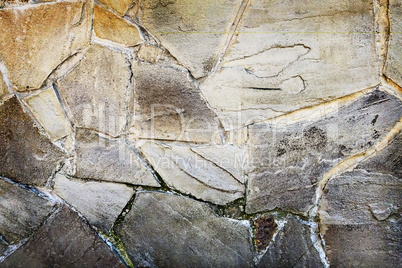 Fragment of an ancient wall from stones. Background image
