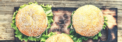 Rustic style, top view. Hamburger on a wooden table. Rustic