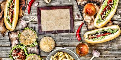 hot dogs and beer on a wooden table. Rustic style, top view homemade burgers with beef