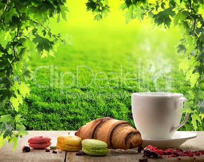 White cup and macaroons