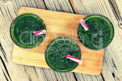 Detox drink made from spinach, cucumber, lime and avocado. DETOX drink made from green vegetables in a blender.