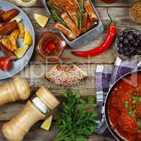 Dining table. Meatballs With parsley and cherry tomatoes and various snacks.