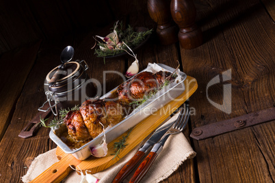 small Rolling roasts fully with dried fruit and bacon