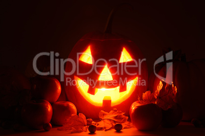 scary pumpkin head with glowing eyes - symbol of Halloween