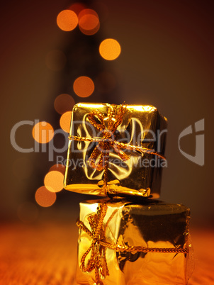 Two golden Christmas gift boxes