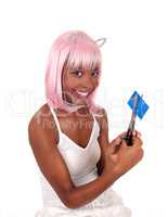 Smiling woman cuting her credit card