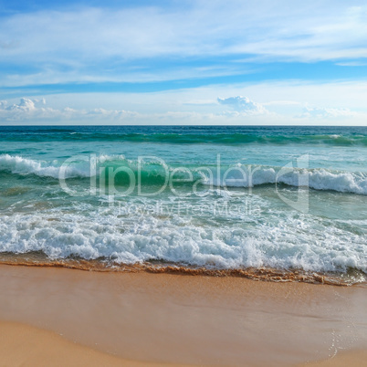 Tropical ocean, high waves and blue sky