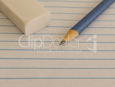 White sheet with pencil and rubber in closed