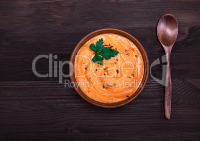 pumpkin soup in a round clay plate