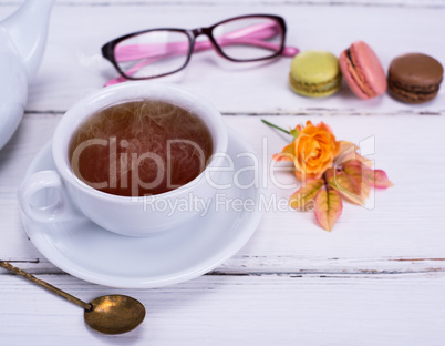 white round cup with black tea
