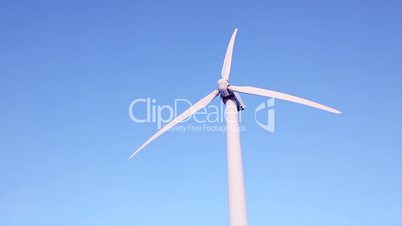 Wind Turbine Spinning In The Desert.