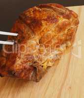 Roasted pork on a wooden cutting board