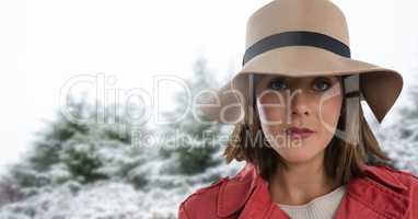 Woman wearing hat in snow forest