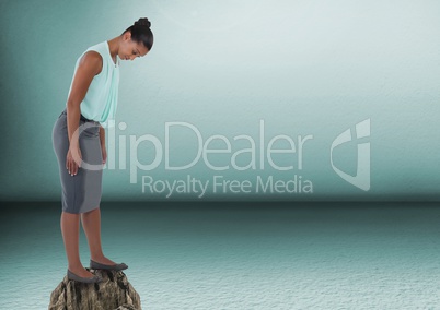 Businesswoman standing on rock in room