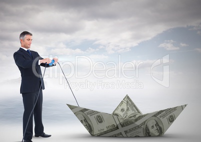 Businessman pulling paper money dollar boat