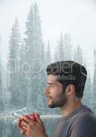 Man with cup and snow fores