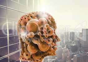 3d head made of cogs cityscape with skyscrapers