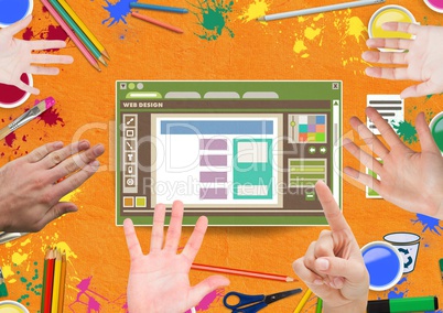 Hands touching Web design editor window and creative art objects on Paper cut out desktop