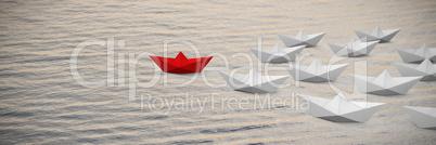 Composite image of digital composite image of paper boats