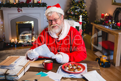 Santa Claus reading a letter