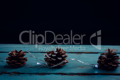 Pine cone decorated with christmas light