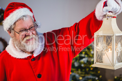 Santa Claus holding Christmas lantern