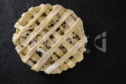 Raw tart on concrete background