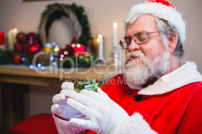 Santa claus holding a gift