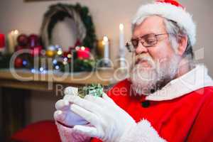 Santa claus holding a gift