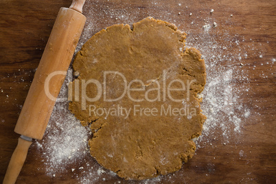 Flattened dough on a wooden table
