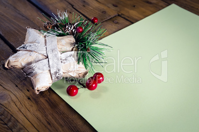 Christmas decoration with blank paper on wooden table