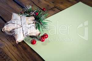 Christmas decoration with blank paper on wooden table