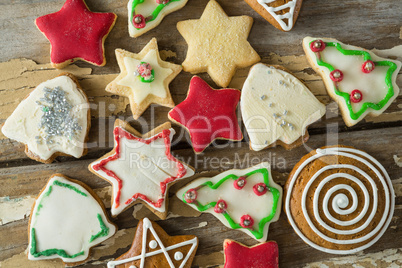 Gingerbread cookies arranged on wooden plank