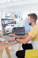 Male executive working on computer at desk