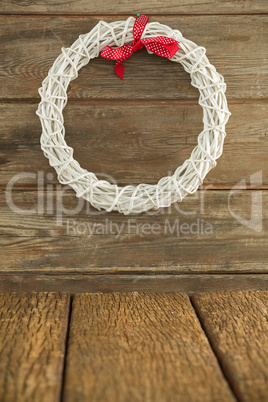 Christmas wreath on wooden surface