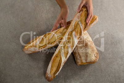 Woman holding a loaf of bread