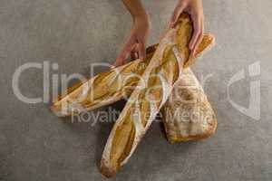 Woman holding a loaf of bread