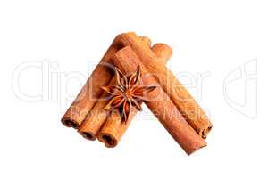 Cinnamon sticks and anise stars on white