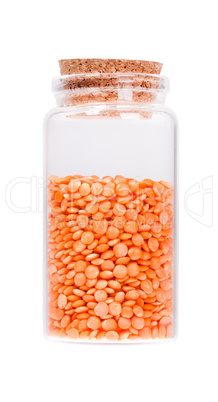 Lentils in a glass bottle with cork stopper, isolated on white.