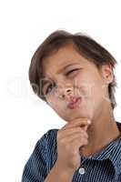 Boy standing against white background